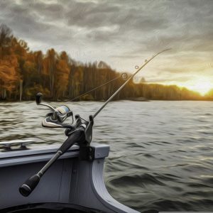 WEDKA Wędka na łodzi o zachodzie słońca nad jeziorem