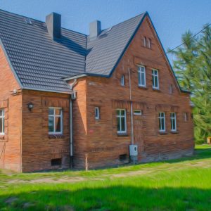 domek Dawny Dom w Łowiskach – ceglany budynek z ogrodem